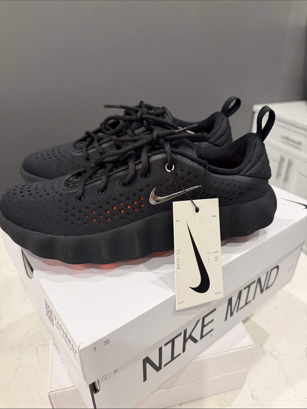Nike Mind women's Black Sneakers with orange Black Accent Perforation